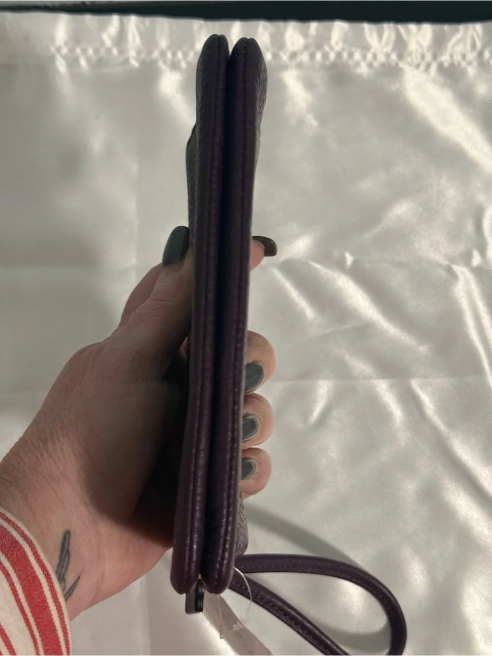 Coach NWT Pebbled Leather Wristlet in Plum w/handtag and two zip compartments.
